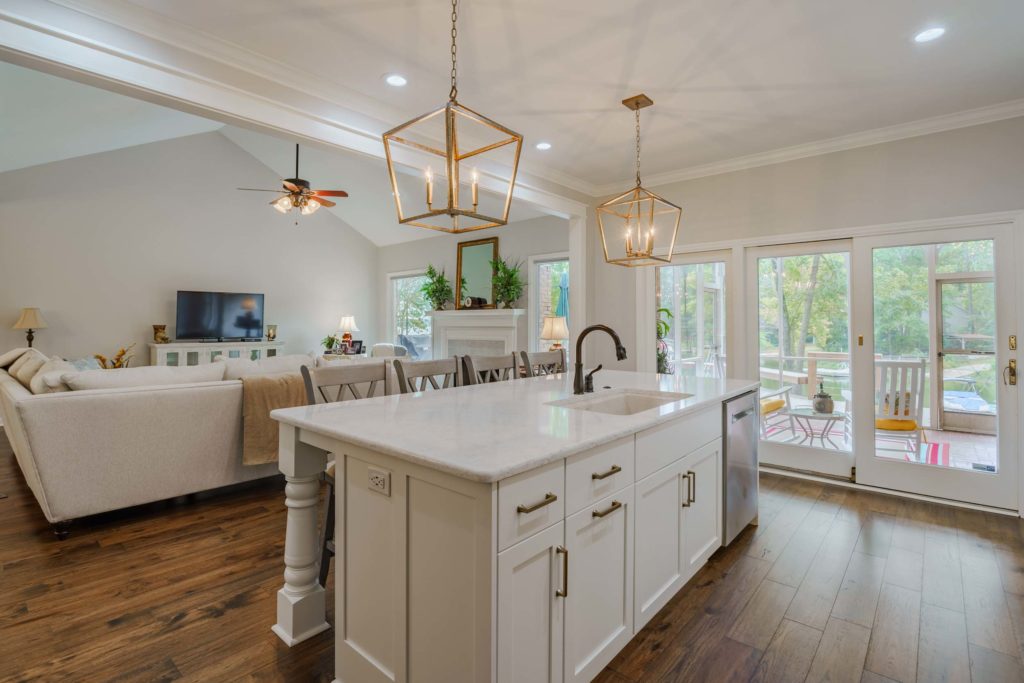 Open concept kitchen with kitchen island and pendant lights| phase one